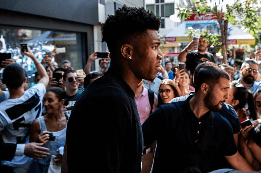 Milwaukee Bucks forward and NBA's Most Valuable Player for the 2018-2019 season Giannis Antetokounmpo leaves a Nike store after attending a promotional event, at the Syntagma square in Athens on June 28, 2019. - Speaking at an event in Athens to promote his line of sports shoes, "Greek Freak" Giannis Antetokounmpo said on June 28, 2019 that he would play for Greece at the FIBA Basketball World Cup in China this summer.