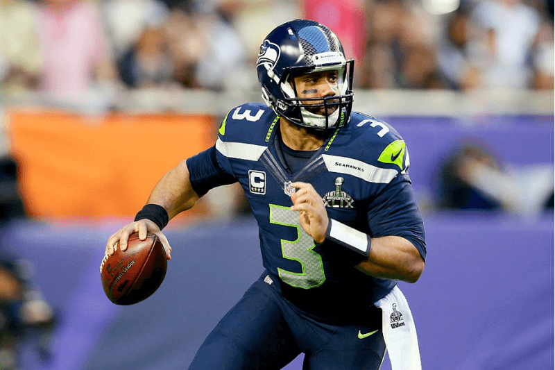 GLENDALE, AZ - FEBRUARY 01: Russell Wilson #3 of the Seattle Seahawks looks to pass in the first quarter against the New England Patriots during Super Bowl XLIX at University of Phoenix Stadium on February 1, 2015 in Glendale, Arizona.