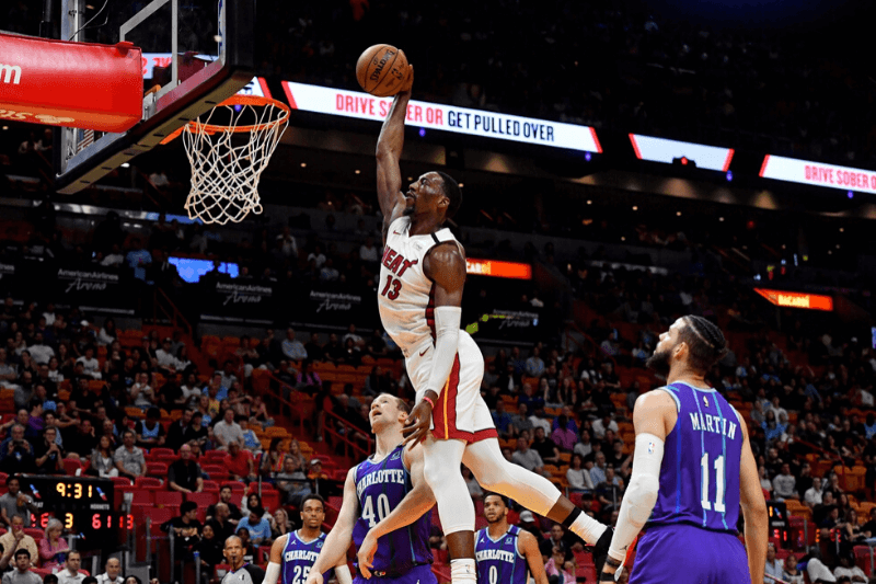 Mar 11, 2020; Miami, Florida, USA; Miami Heat forward Bam Adebayo (13) dunks the ball against the Charlotte Hornets during the second half at American Airlines Arena.