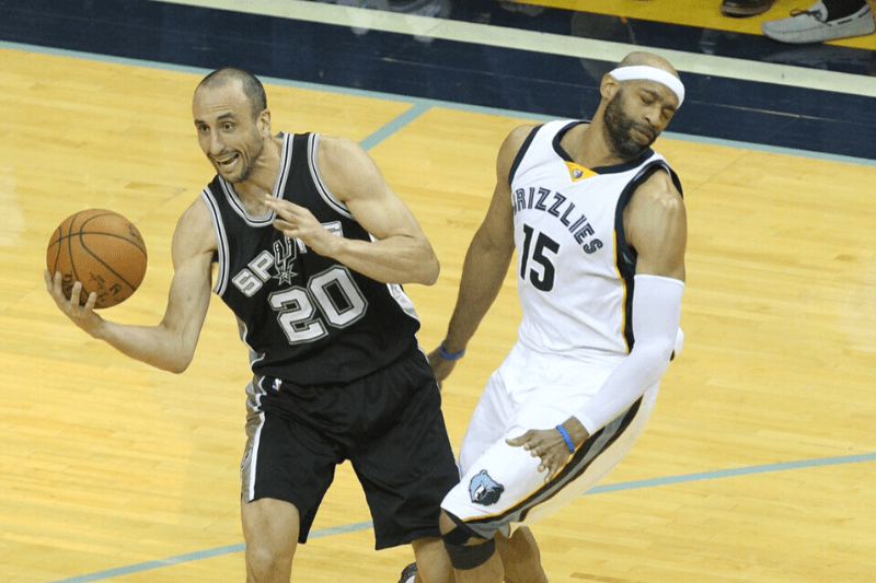 Apr 27, 2017; Memphis, TN, USA; San Antonio Spurs guard Manu Ginobili (20) is fouled by Memphis Grizzlies guard Vince Carter (15) in game six of the first round of the 2017 NBA Playoffs at FedExForum