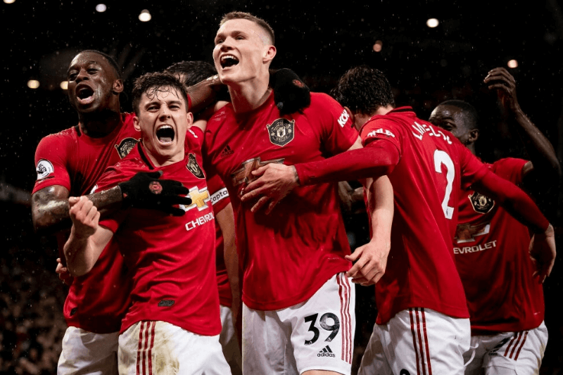 MANCHESTER, ENGLAND - MARCH 08: Scott McTominay of Manchester United celebrates scoring their second goal during the Premier League match between Manchester United and Manchester City at Old Trafford on March 08, 2020 in Manchester, United Kingdom. 