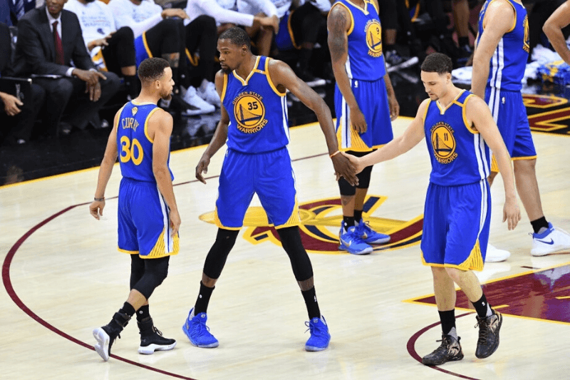 CLEVELAND, OH - JUNE 07: Stephen Curry #30, Kevin Durant #35 and Klay Thompson #11 of the Golden State Warriors react against the Cleveland Cavaliers during the first half of Game 3 of the 2017 NBA Finals at Quicken Loans Arena on June 7, 2017 in Cleveland, Ohio.