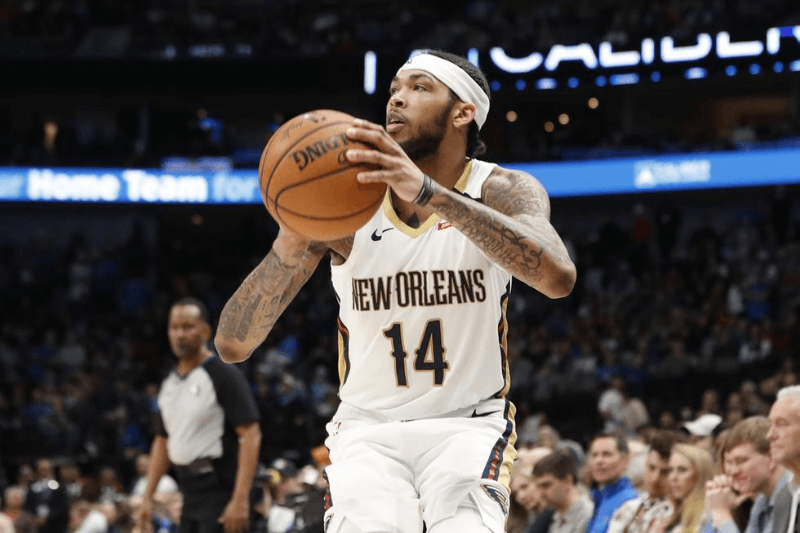 Mar 4, 2020; Dallas, Texas, USA; New Orleans Pelicans forward Brandon Ingram (14) shoots during the second half against the Dallas Mavericks at American Airlines Center.