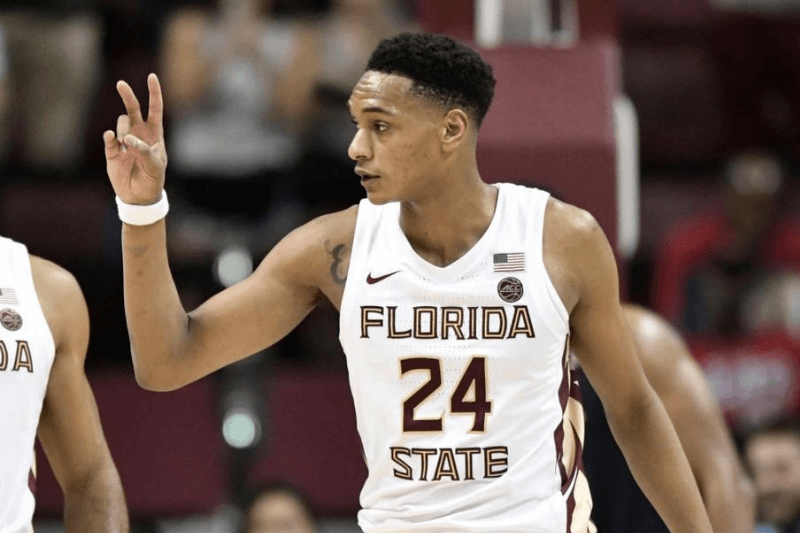 TALLAHASSEE, FL - JANUARY 15: Devin Vassell (24) guard Florida State University (FSU) Seminoles signals his score to the bench during the game against the University of Virginia Cavaliers, Wednesday, January 15, 2020, in the Donald Tucker Civic Center in Tallahassee, Florida.