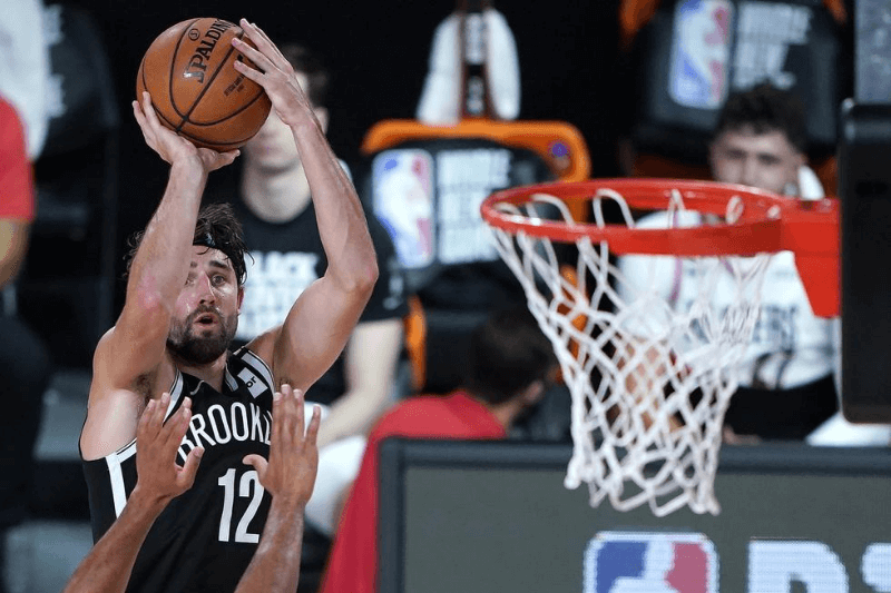 Aug 13, 2020; Lake Buena Vista, Florida, USA; Brooklyn Nets' Joe Harris shoots against the Portland Trail Blazers during the second half of an NBA basketball game at ESPN Wide World of Sports Complex.