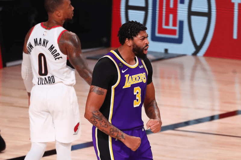 Aug 22, 2020; Lake Buena Vista, Florida, USA; Los Angeles Lakers forward Anthony Davis (3) reacts after dunking against the Portland Trail Blazers in the second half in game three of the first round of the 2020 NBA Playoffs at AdventHealth Arena