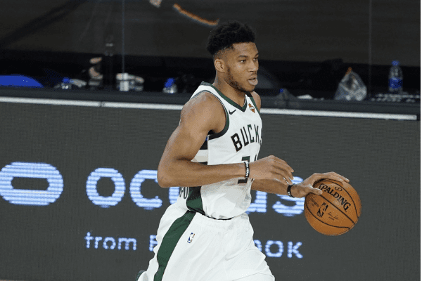 ug 24, 2020; Lake Buena Vista, Florida, USA; Milwaukee Bucks' Giannis Antetokounmpo drives up court against the Orlando Magic during the second half in game four of the first round of the 2020 NBA Playoffs at The Field House.