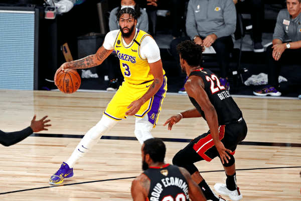 Oct 6, 2020; Miami, Florida, USA; Los Angeles Lakers forward Anthony Davis (3) handles the ball against Miami Heat forward Jimmy Butler (22) during the second quarter in game 4 of the 2020 NBA Finals at AdventHealth Arena.