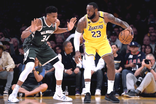 LeBron James #23 of the Los Angeles Lakers backs in on Giannis Antetokounmpo #34 of the Milwaukee Bucks during the third quarter at Staples Center on March 06, 2020 in Los Angeles, California.