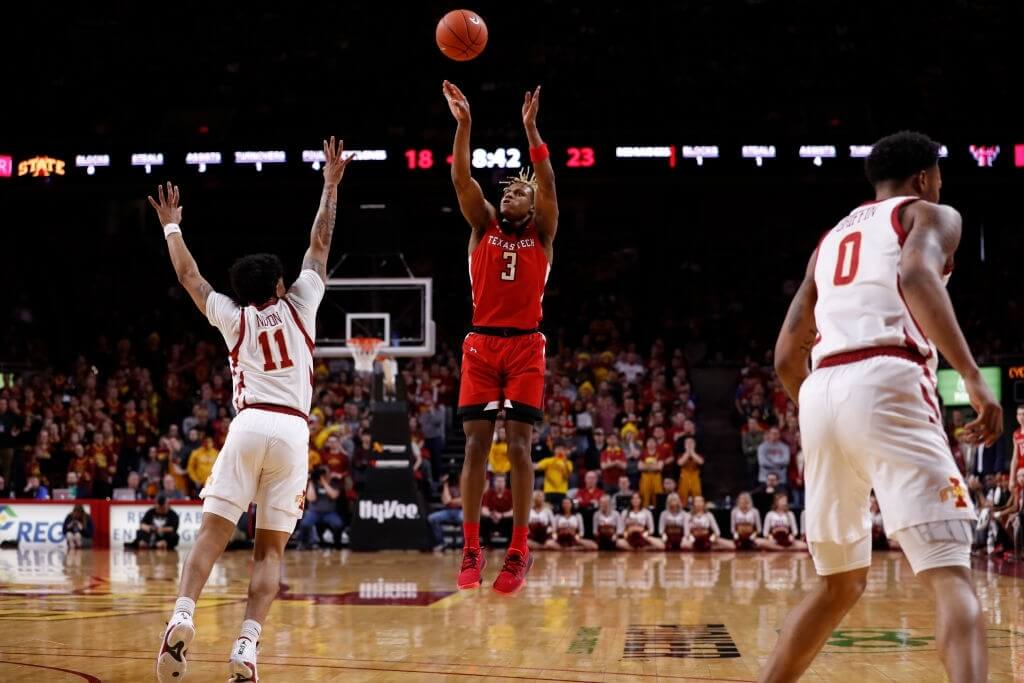 Jahmi'us Ramsey #3 of the Texas Tech Red Raiders takes a three point shot as Prentiss Nixon #11 of the Iowa State Cyclones blocks in the first half of the play at Hilton Coliseum on February 22, 2020 in Ames, Iowa. 
