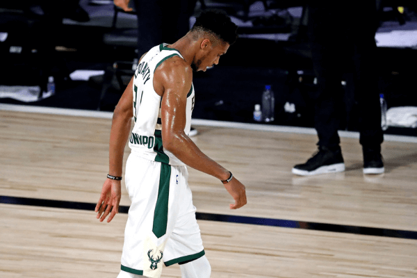Sep 4, 2020; Lake Buena Vista, Florida, USA; Milwaukee Bucks forward Giannis Antetokounmpo (34) walks off the court after being defeating by the Miami Heat in game three of the second round of the 2020 NBA Playoffs at ESPN Wide World of Sports Complex.