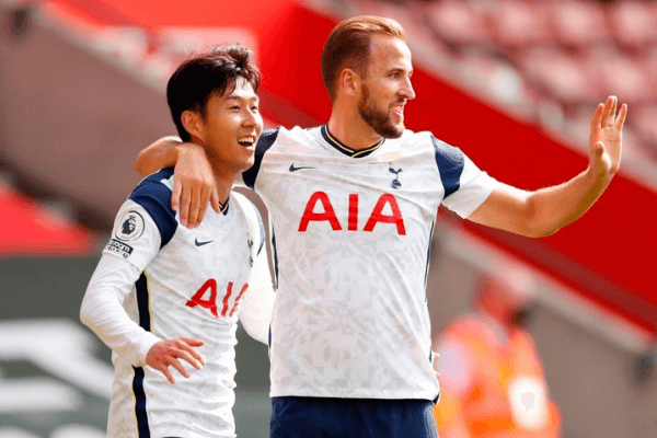 Tottenham Hotspur's South Korean striker Son Heung-Min celebrates with Tottenham Hotspur's English striker Harry Kane (R) after scoring his and their third goal during the English Premier League football match between Southampton and Tottenham Hotspur at St Mary's Stadium in Southampton, southern England on September 20, 2020.