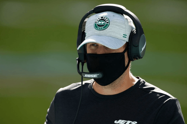 Head coach Adam Gase of the New York Jets looks on from the field during pre-game warm-up at Hard Rock Stadium on October 18, 2020 in Miami Gardens, Florida.