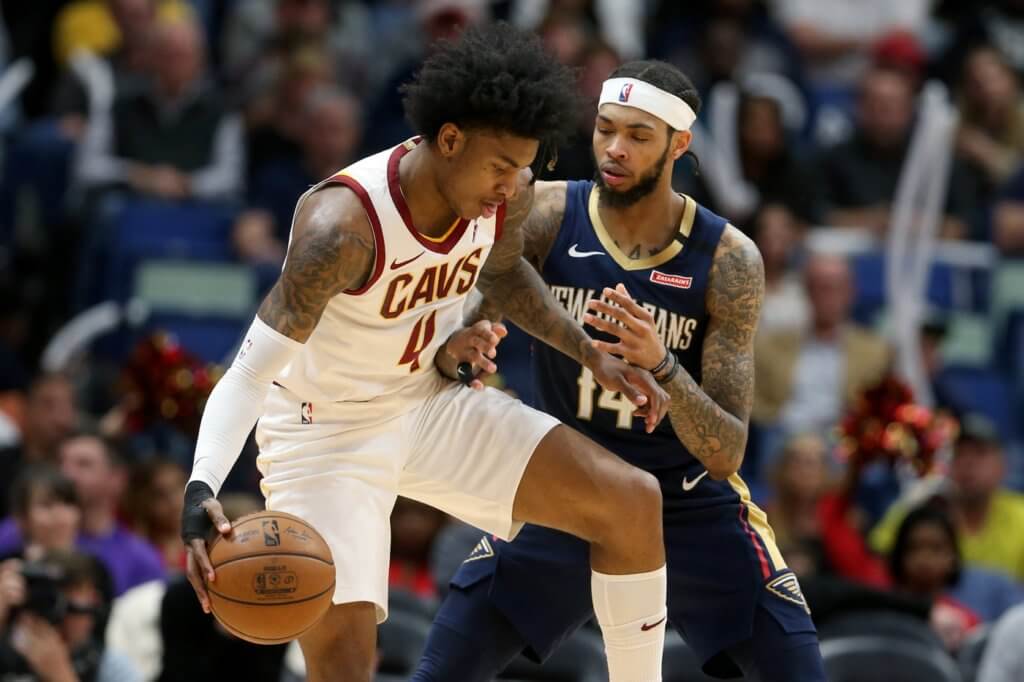 Cleveland Cavaliers guard Kevin Porter Jr. (4) is defended by New Orleans Pelicans forward Brandon Ingram (14) in the second half at the Smoothie King Center.