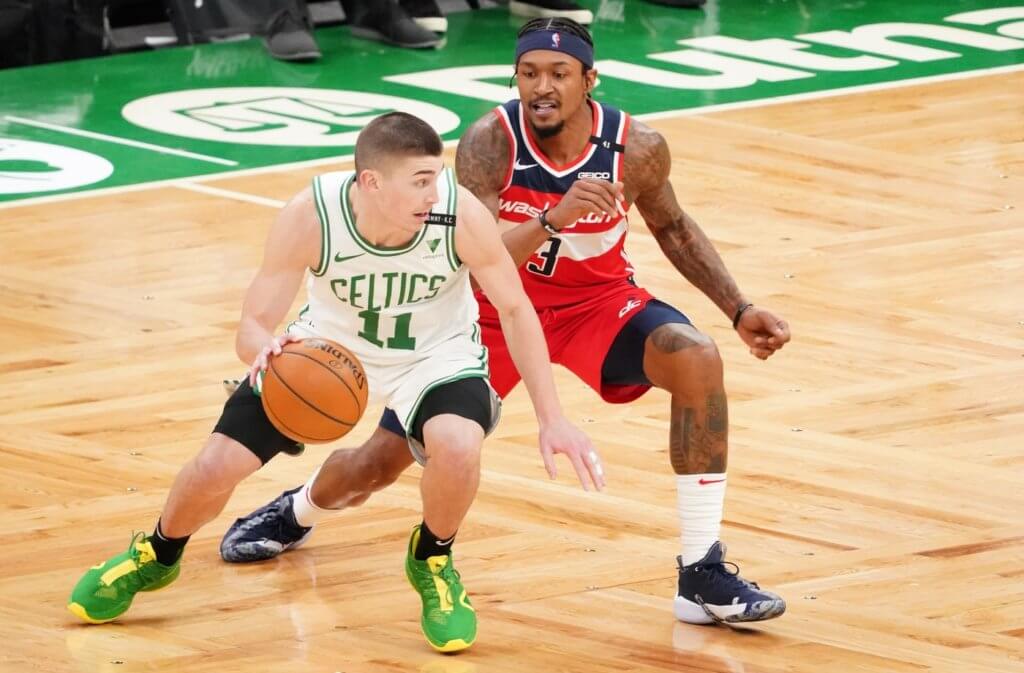 Washington Wizards guard Bradley Beal (3) defends against Boston Celtics guard Payton Pritchard (11) in the third quarter at TD Garden.