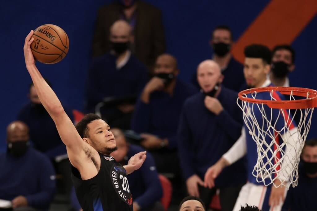 Dec 26, 2020; New York, New York, USA; New York Knicks forward Kevin Knox II slam dunks the ball during the second half of an NBA basketball game against the Philadelphia 76ers on Saturday, Dec. 26, 2020, in New York. The 76ers defeated the Knicks 109-89 at Madison Square Garden. Mandatory Credit: Adam Hunger/Pool Photo-USA TODAY Sports
