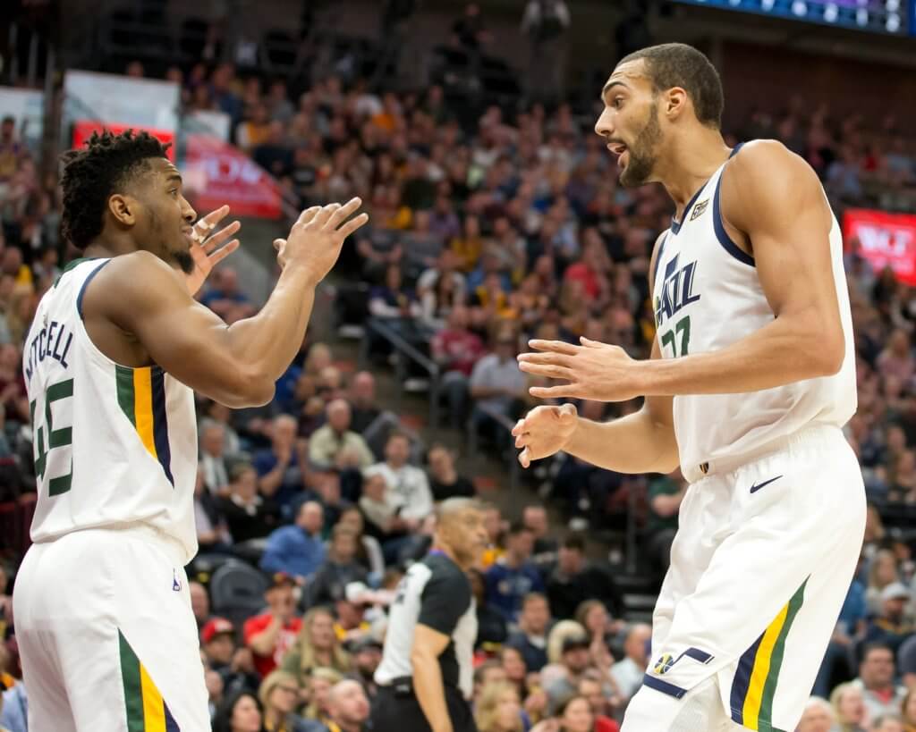 Utah Jazz center Rudy Gobert (27) and guard Donovan Mitchell (45) react during the first quarter against the Sacramento Kings at Vivint Smart Home Arena.
