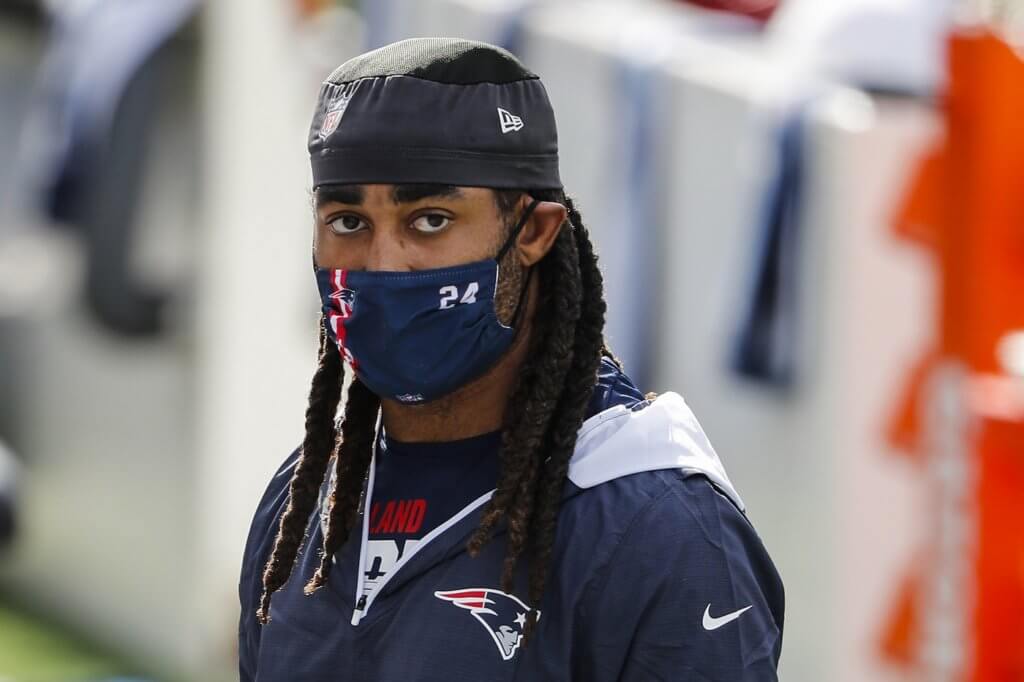 New England Patriots cornerback Stephon Gilmore (24) leaves the field after warming up before a game against the Denver Broncos at Gillette Stadium. 