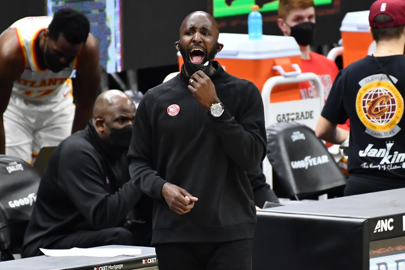 Atlanta Hawks head coach Lloyd Pierce yells to his team during the third quarter against the Cleveland Cavaliers at Rocket Mortgage FieldHouse.