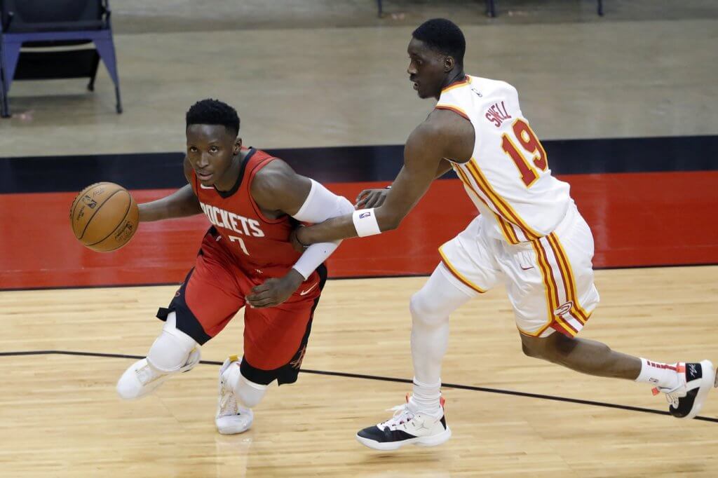Houston Rockets guard Victor Oladipo (7) is fouled as he drives around Atlanta Hawks guard Tony Snell (19) during the second half at Toyota Center.