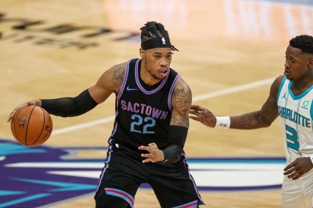 Mar 15, 2021; Charlotte, North Carolina, USA; Sacramento Kings center Richaun Holmes (22) brings the ball up court against Charlotte Hornets guard Terry Rozier (3) during the second half at Spectrum Center. The Charlotte Hornets won 122-116. Mandatory Credit: Nell Redmond-USA TODAY Sports