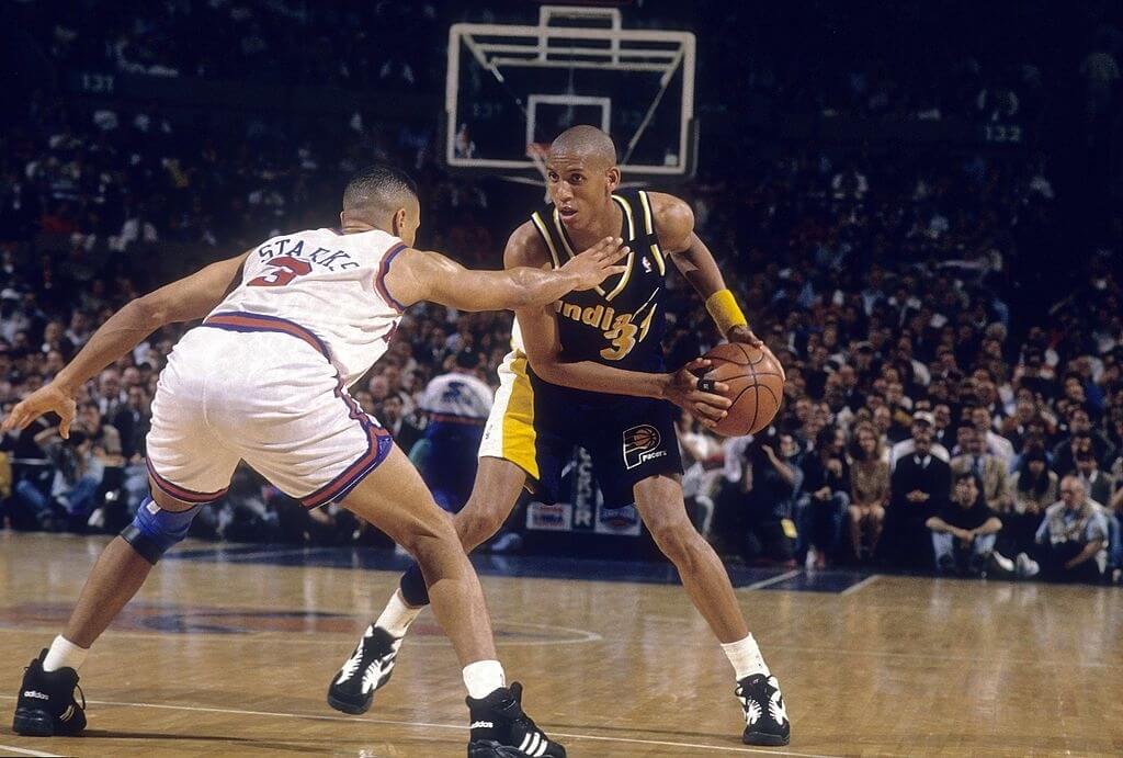 MANHATTAN, NY - CIRCA 1990's: Guard Reggie Miller #31 of the Indiana Pacers is guarded closely by John Starks #3 of the New York Knicks circa mid 1990's during an NBA basketball game at Madison Square Garden in Manhattan, New York. Miller played for the Pacers from 1987-05. (Photo by Focus on Sport/Getty Images)