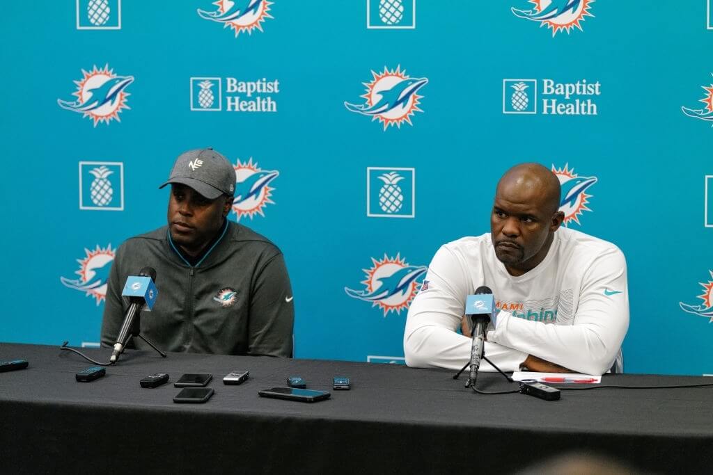 General Manager Chris Grier and Head Coach Brian Flores of the Miami Dolphins answers questions from the media during a season ending press conference at Baptist Health Training Facility at Nova Southern University on December 30, 2019 in Davie, Florida