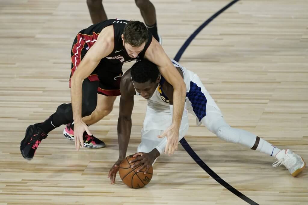 Aug 24, 2020; Lake Buena Vista, Florida, USA; Miami Heat's Goran Dragic, left, and Indiana Pacers' Victor Oladipo scramble for the ball during the second half in game four of the first round of the 2020 NBA Playoffs at The Field House. Mandatory Credit: Ashley Landis/Pool Photo-USA TODAY Sports
