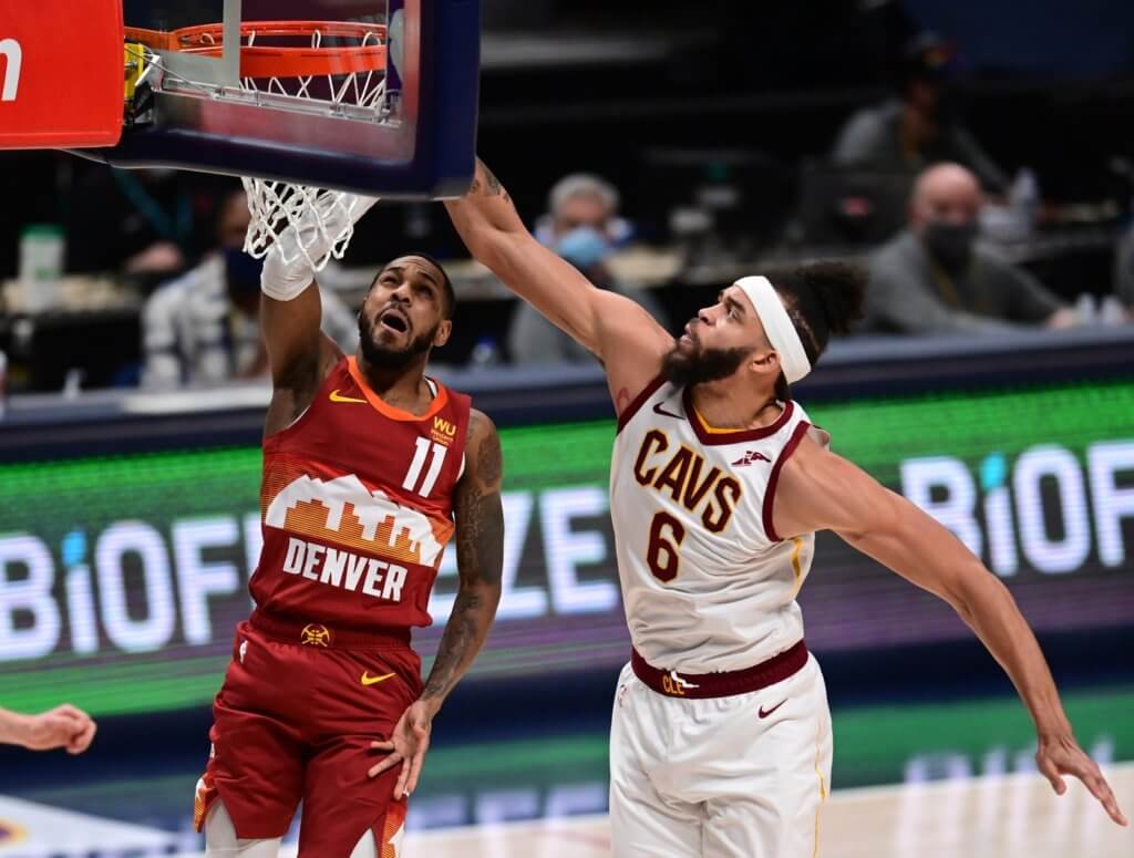 Feb 10, 2021; Denver, Colorado, USA; Cleveland Cavaliers center JaVale McGee (6) blocks the shot of Denver Nuggets guard Monte Morris (11) in the first first quarter at Ball Arena. Mandatory Credit: Ron Chenoy-USA TODAY Sports


