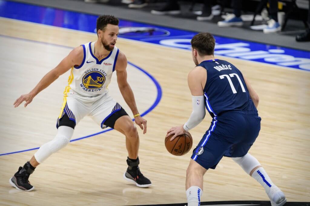 Feb 6, 2021; Dallas, Texas, USA; Golden State Warriors guard Stephen Curry (30) and Dallas Mavericks guard Luka Doncic (77) in action during the game between the Dallas Mavericks and the Golden State Warriors at the American Airlines Center. Mandatory Credit: Jerome Miron-USA TODAY Sports