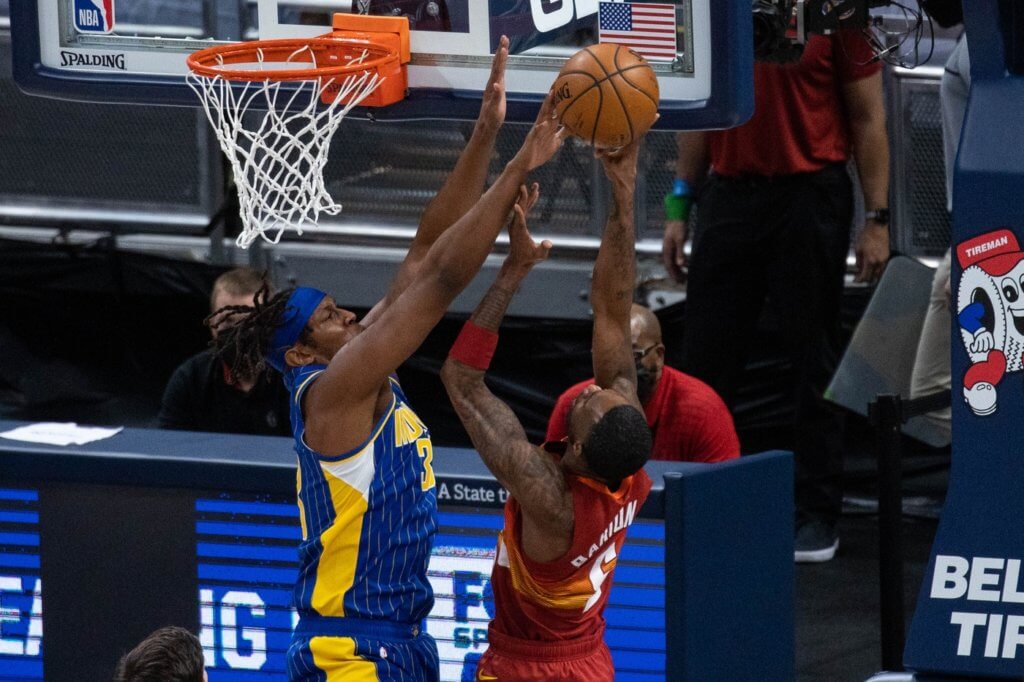 Mar 4, 2021; Indianapolis, Indiana, USA; Indiana Pacers center Myles Turner (33) blocks the shot of Denver Nuggets forward Will Barton (5) in the first quarter at Bankers Life Fieldhouse. Mandatory Credit: Trevor Ruszkowski-USA TODAY Sports