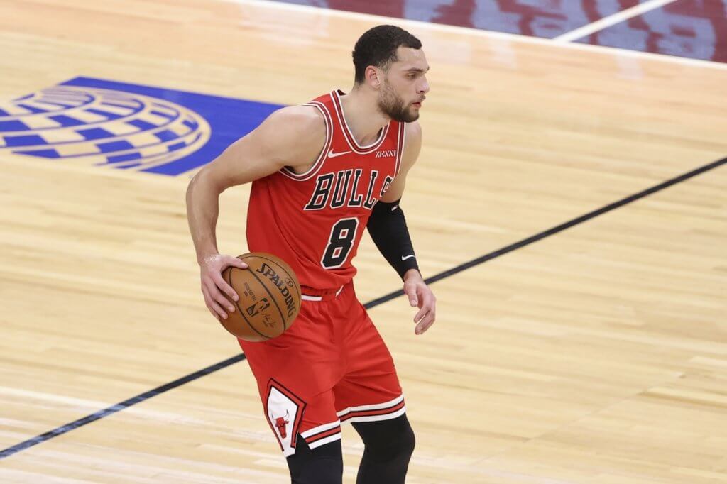 Feb 1, 2021; Chicago, Illinois, USA; Chicago Bulls guard Zach LaVine (8) looks to pass the ball against the New York Knicks during the first half of an NBA game at United Center. Mandatory Credit: Kamil Krzaczynski-USA TODAY Sports
