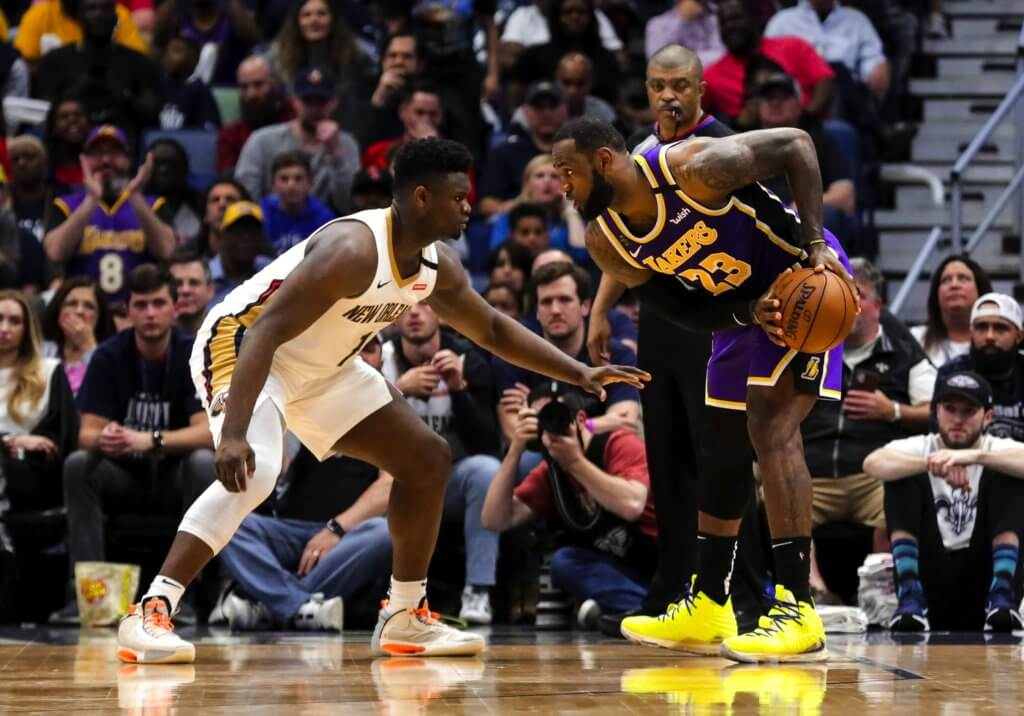 Mar 1, 2020; New Orleans, Louisiana, USA; New Orleans Pelicans forward Zion Williamson (1) defends against Los Angeles Lakers forward LeBron James (23) during the fourth quarter at the Smoothie King Center. Mandatory Credit: Derick E. Hingle-USA TODAY Sports