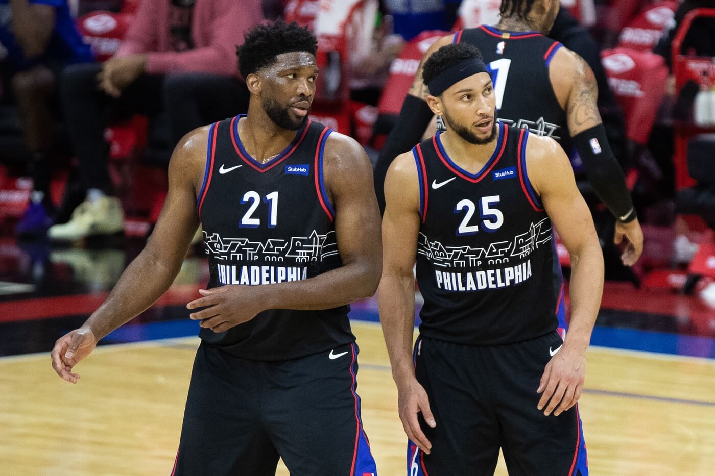 Feb 27, 2021; Philadelphia, Pennsylvania, USA; Philadelphia 76ers guard Ben Simmons (25) and center Joel Embiid (21) look on during the third quarter against the Cleveland Cavaliers at Wells Fargo Center. Mandatory Credit: Bill Streicher-USA TODAY Sports