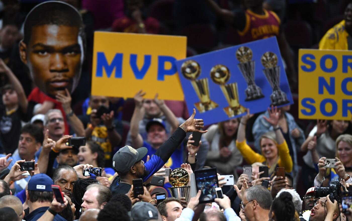 Jun 8, 2018; Cleveland, OH, USA; Golden State Warriors forward Kevin Durant (middle) holds the Bill Russell NBA Finals Most Valuable Player Award after defiant the Cleveland Cavaliers in game four of the 2018 NBA Finals at Quicken Loans Arena.