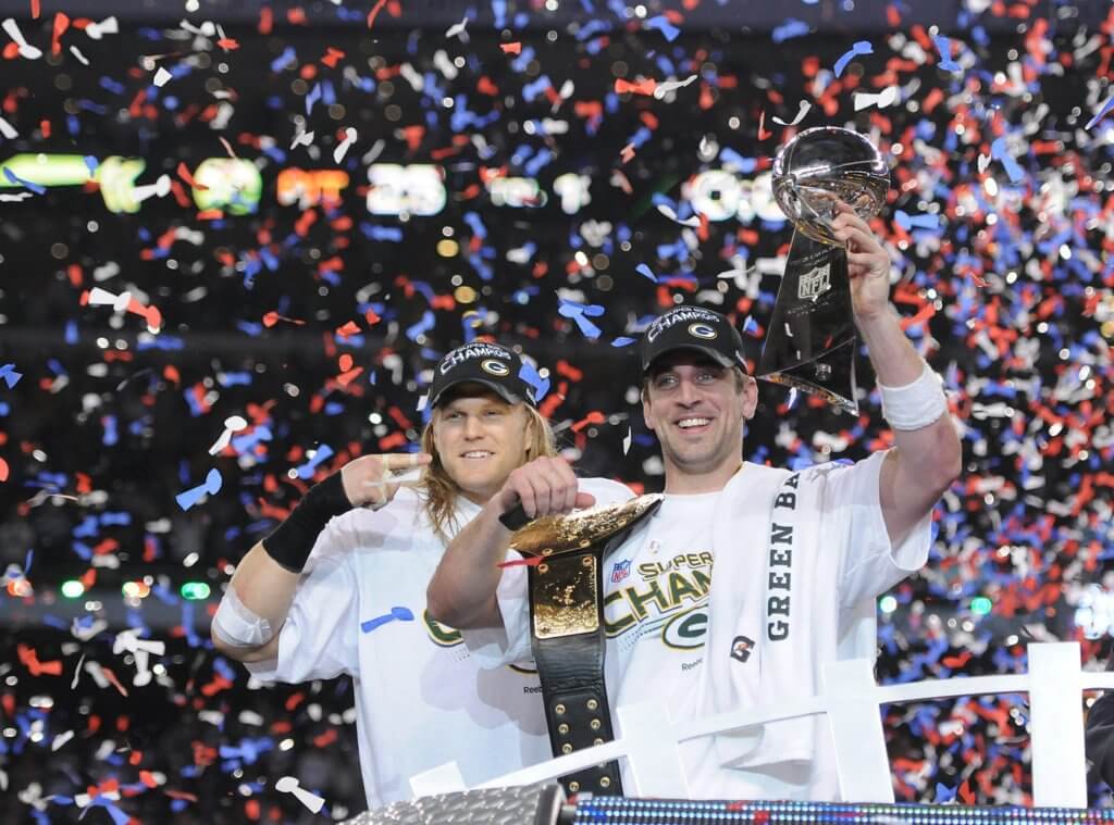 Green Bay Packers linebacker Clay Matthews, left, points to Super Bowl MVP Aaron Rodgers after giving him a championship belt after the win against the Pittsburgh Steelers during Super Bowl XLV at Cowboys Stadium in Arlington, Texas on Feb. 6, 2011. Super Bowl Xlv