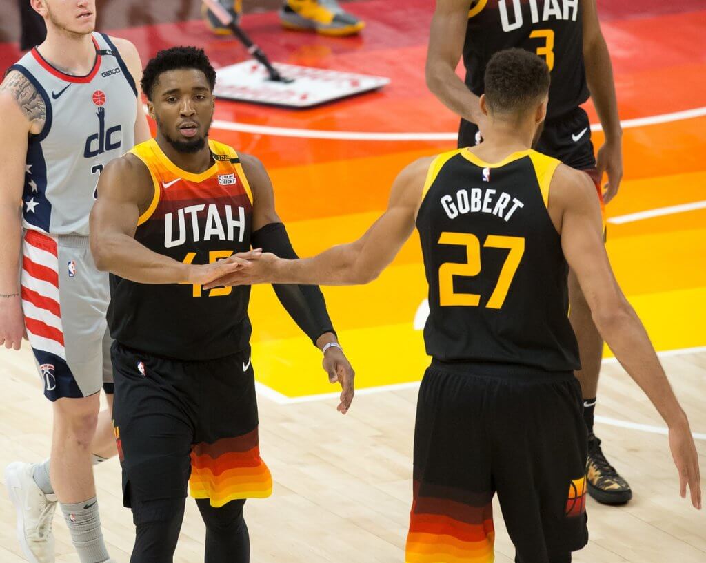 Apr 12, 2021; Salt Lake City, Utah, USA; Utah Jazz guard Donovan Mitchell (45) and center Rudy Gobert (27) react during the first half against the Washington Wizards at Vivint Smart Home Arena. Mandatory Credit: Russell Isabella-USA TODAY Sports