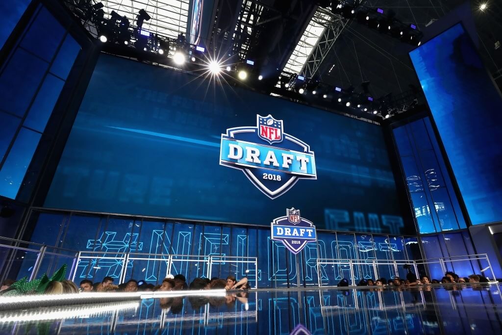 The 2018 NFL Draft logo is seen on a video board during the first round of the 2018 NFL Draft at AT&T Stadium on April 26, 2018 in Arlington, Texas.