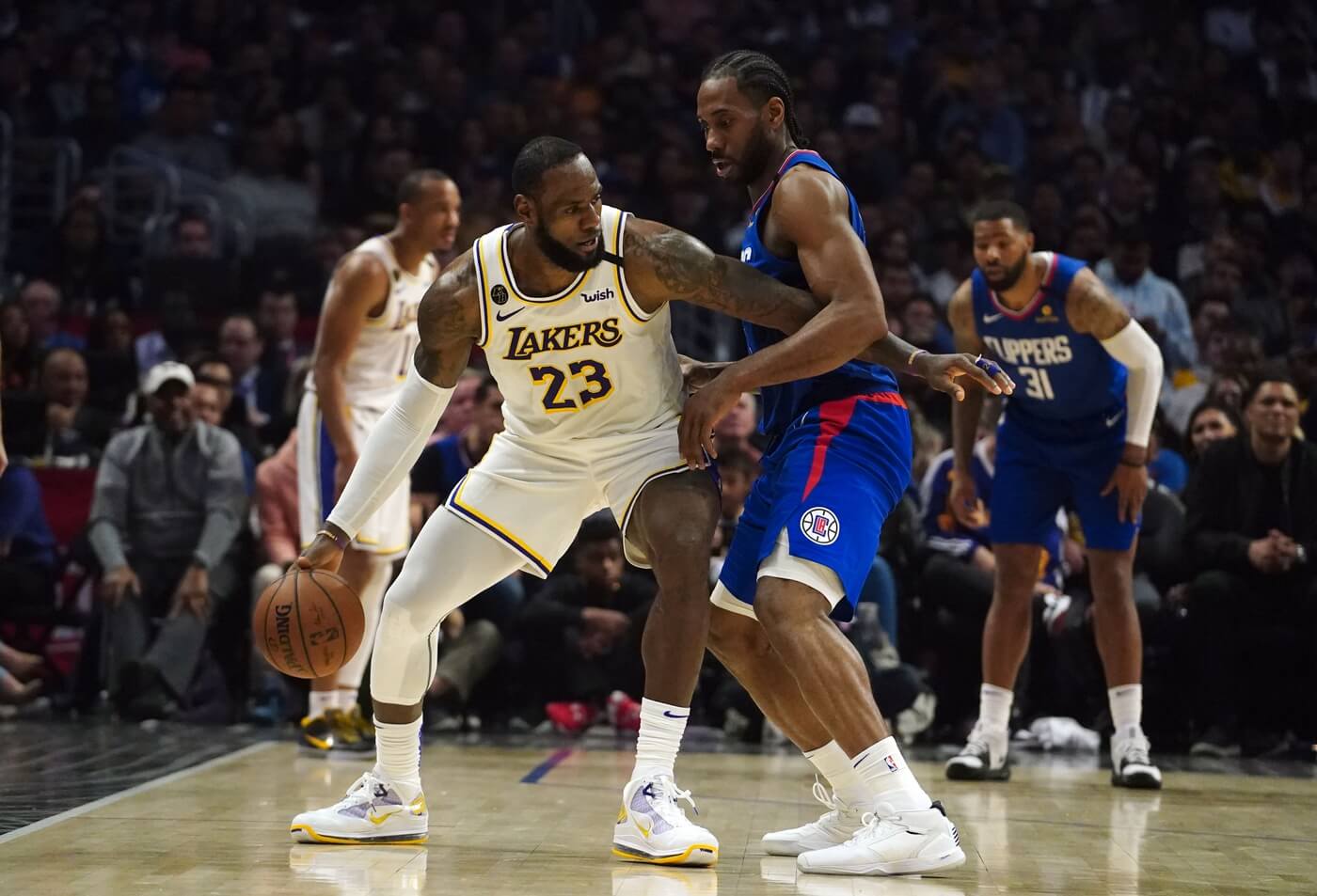 Mar 8, 2020; Los Angeles, California, USA; Los Angeles Lakers forward LeBron James (23) is defended by LA Clippers forward Kawhi Leonard (2) in the second half at Staples Center. The Lakers defeated the Clippers 112-100. Mandatory Credit: Kirby Lee-USA TODAY Sports