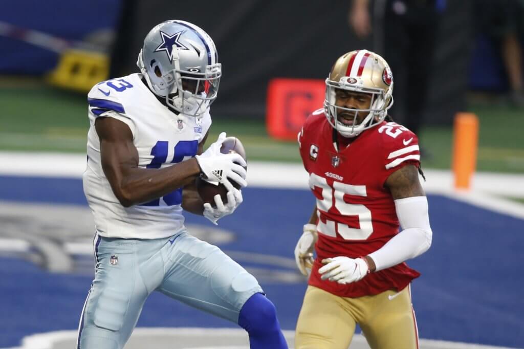Dec 20, 2020; Arlington, Texas, USA; Dallas Cowboys wide receiver Michael Gallup (13) catches a touchdown pass against San Francisco 49ers cornerback Richard Sherman (25) in the first quarter at AT&T Stadium. Mandatory Credit: Tim Heitman-USA TODAY Sports


