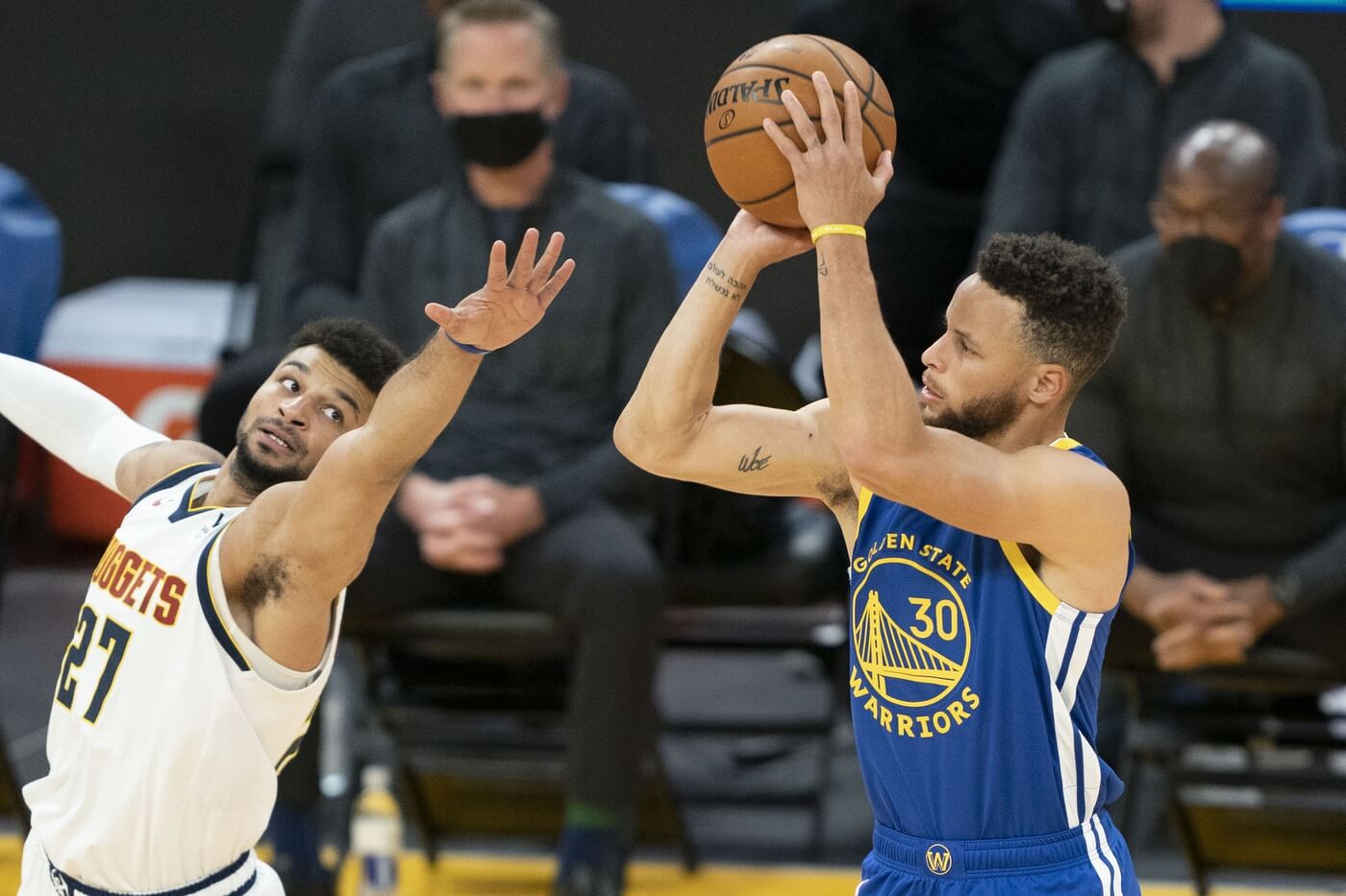 April 12, 2021; San Francisco, California, USA; Golden State Warriors guard Stephen Curry (30) shoots the basketball against Denver Nuggets guard Jamal Murray (27) during the first quarter at Chase Center. Mandatory Credit: Kyle Terada-USA TODAY Sports