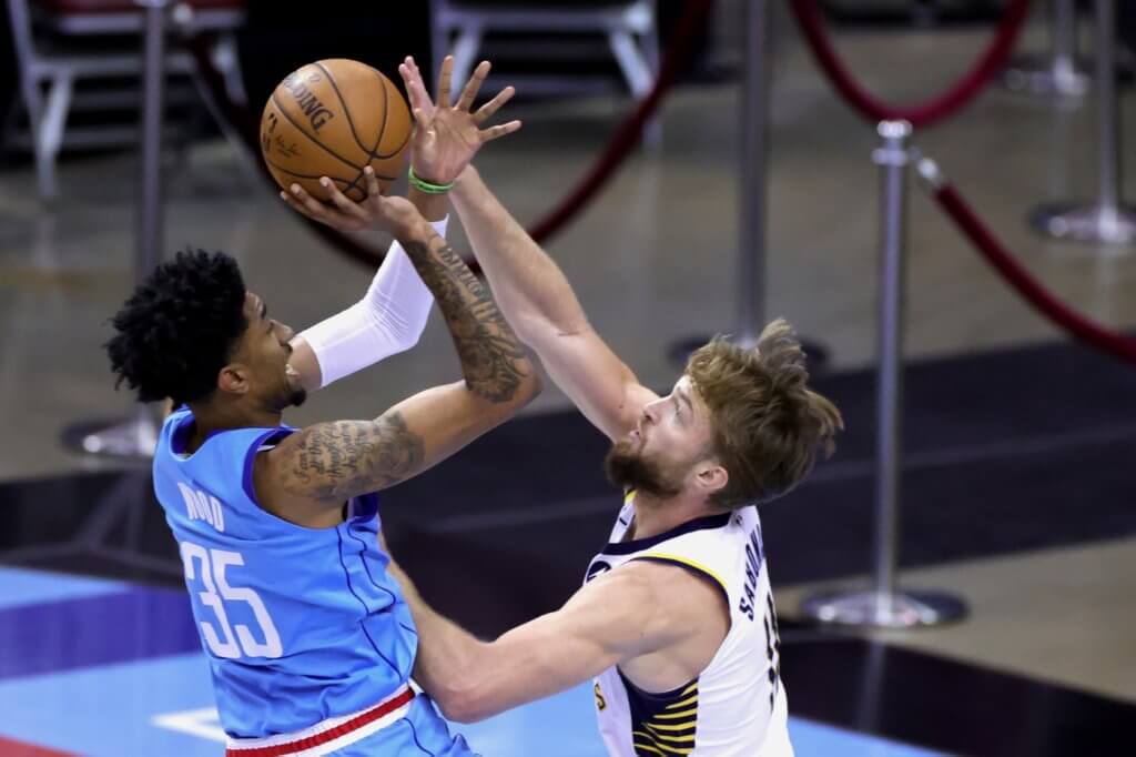 Apr 14, 2021; Houston, Texas, USA; Christian Wood #35 of the Houston Rockets shoots a basket over Domantas Sabonis #11 of the Indiana Pacers during the first quarter at Toyota Center. Mandatory Credit: Carmen Mandato/POOL PHOTOS-USA TODAY Sports