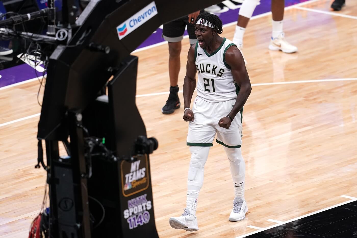 Apr 3, 2021; Sacramento, California, USA; Milwaukee Bucks guard Jrue Holiday (21) reacts after being fouled while making a shot against the Sacramento Kings in the fourth quarter at the Golden 1 Center. Mandatory Credit: Cary Edmondson-USA TODAY Sports