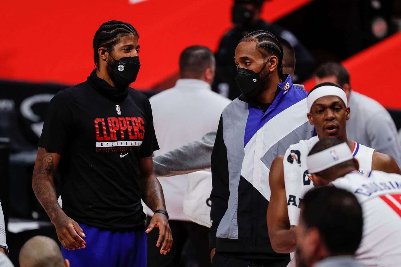 Clippers guard Paul George, left, talks to Kawhi Leonard at a timeout during the second half at the Little Caesars Arena on Wednesday, April 14, 2021.