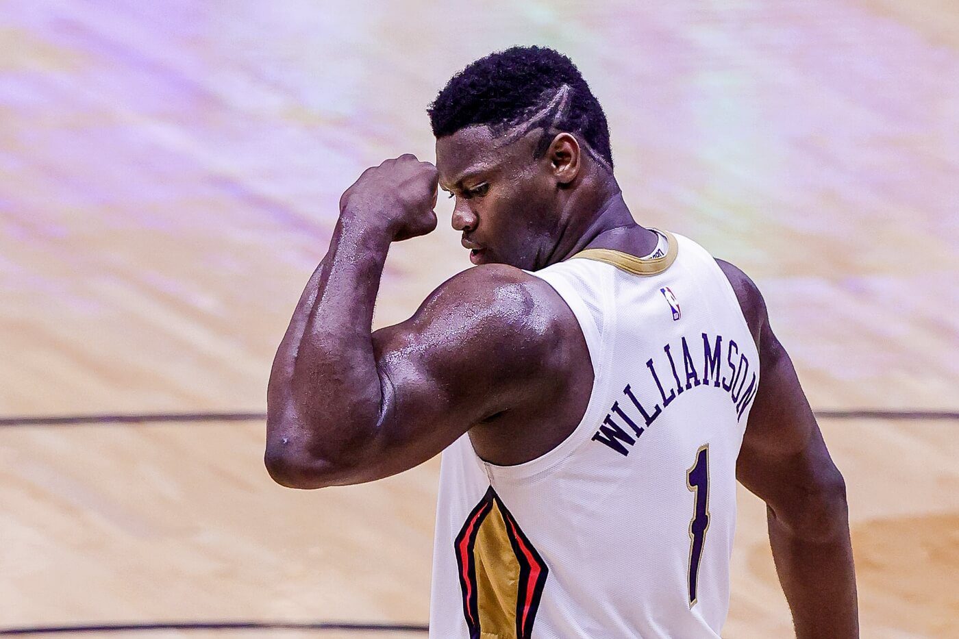 May 3, 2021; New Orleans, Louisiana, USA; New Orleans Pelicans forward Zion Williamson (1) flexes his muscle after making a basket against Golden State Warriors forward Draymond Green (23) during the second half at the Smoothie King Center. Mandatory Credit: Stephen Lew-USA TODAY Sports