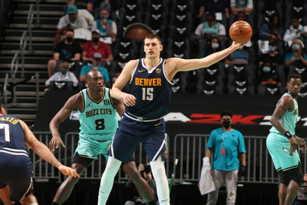 CHARLOTTE, NC - MAY 11:  Nikola Jokic #15 of the Denver Nuggets handles the ball against the Charlotte Hornets on May 11, 2021 at Spectrum Center in Charlotte, North Carolina. NOTE TO USER: User expressly acknowledges and agrees that, by downloading and or using this photograph, User is consenting to the terms and conditions of the Getty Images License Agreement. Mandatory Copyright Notice: Copyright 2021 NBAE (Photo by Kent Smith/NBAE via Getty Images)