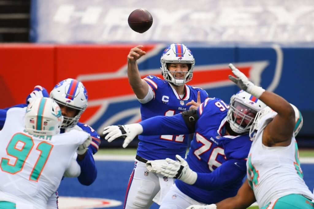 Jan 3, 2021; Orchard Park, New York, USA; Buffalo Bills quarterback Josh Allen (17) throws a pass against the Miami Dolphins during the second quarter at Bills Stadium. Mandatory Credit: Rich Barnes-USA TODAY Sports

