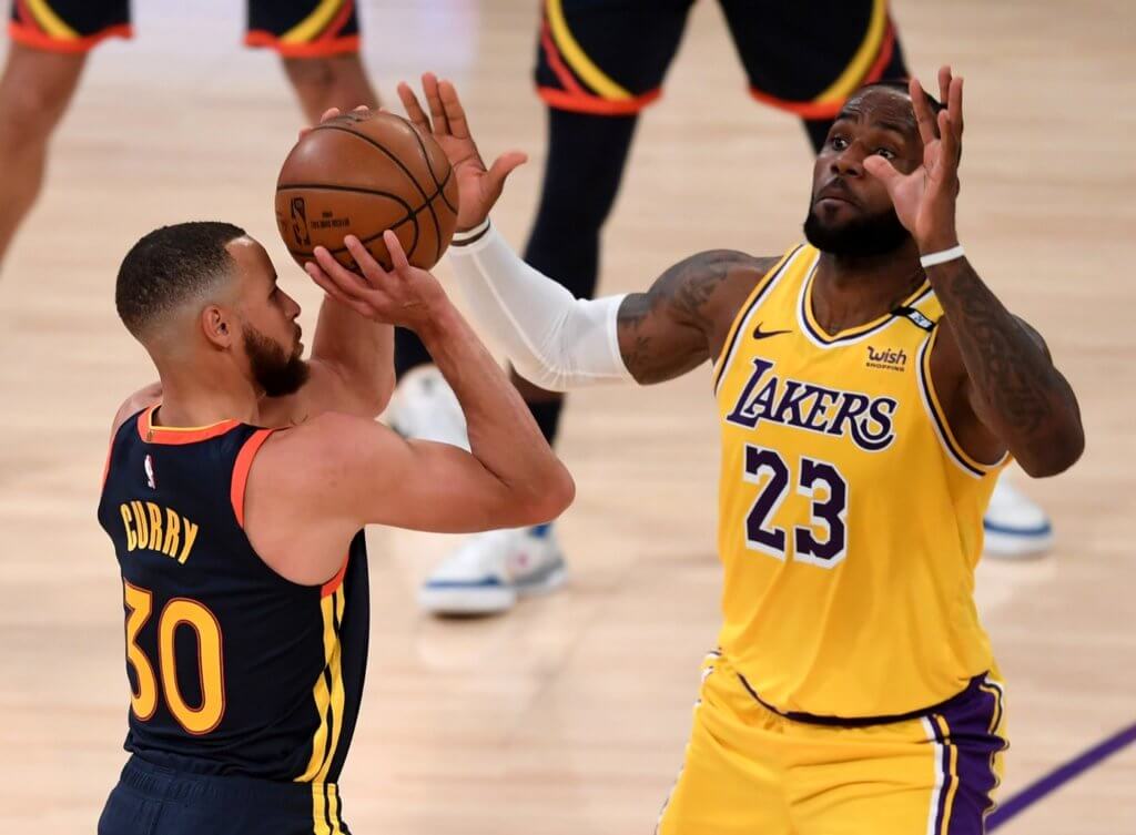 May 19, 2021; Los Angeles, California, USA; Golden State Warriors guard Stephen Curry (30) shoots a basket over Los Angeles Lakers forward LeBron James (23) in the first half of the game at Staples Center. Mandatory Credit: Jayne Kamin-Oncea-USA TODAY Sports