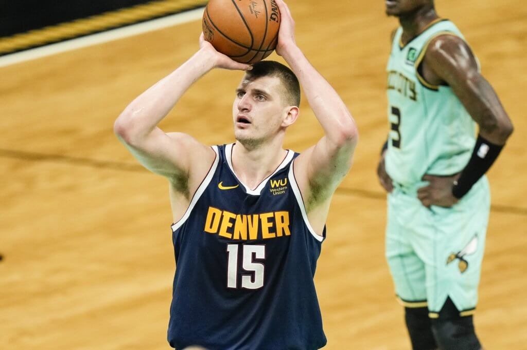 May 11, 2021; Charlotte, North Carolina, USA; Denver Nuggets center Nikola Jokic (15) takes a free throw against the Charlotte Hornets during the second quarter at the Spectrum Center. Mandatory Credit: Jim Dedmon-USA TODAY Sports