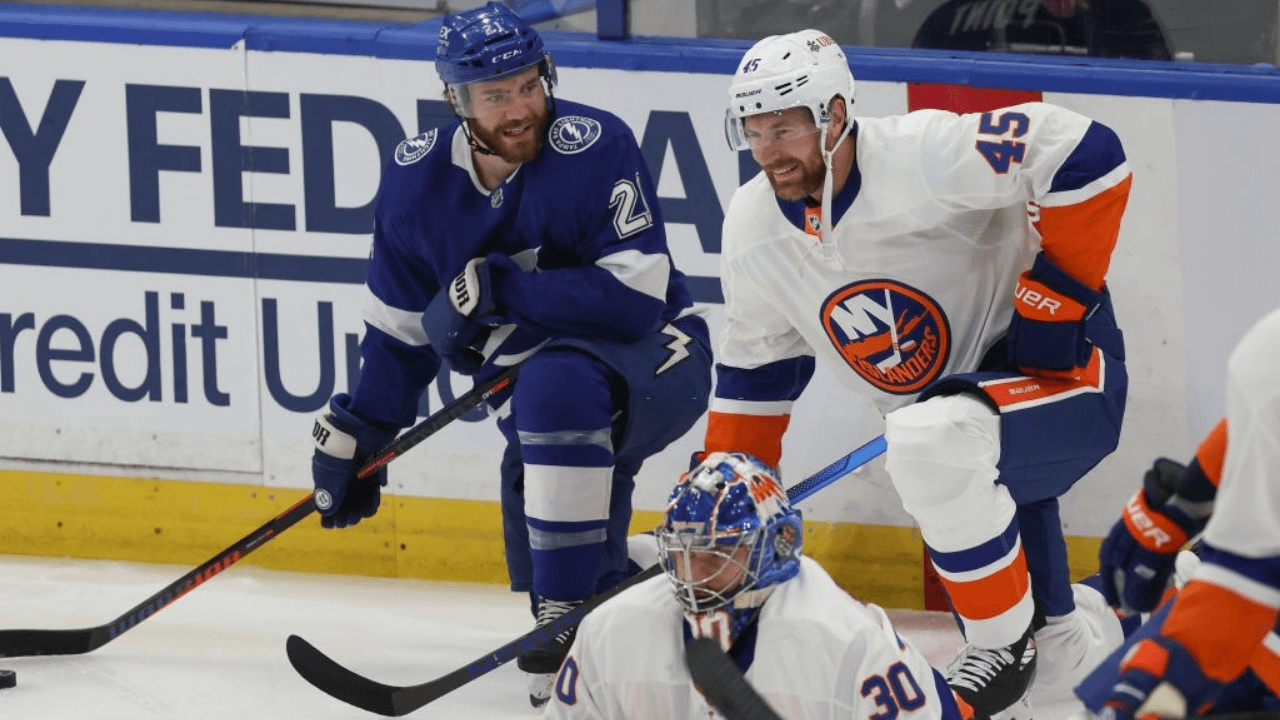TAMPA, FL - JUNE 13: Tampa Bay Lightning center Brayden Point (21) talks to New York Islanders defenseman Braydon Coburn (45) skates during warm ups before Game 1 of the Stanley Cup Playoffs Semifinals between the New York Islanders and Tampa Bay Lightning on June 13, 2021 at Amalie Arena in Tampa, FL. (Photo by Mark LoMoglio/Icon Sportswire via Getty Images)